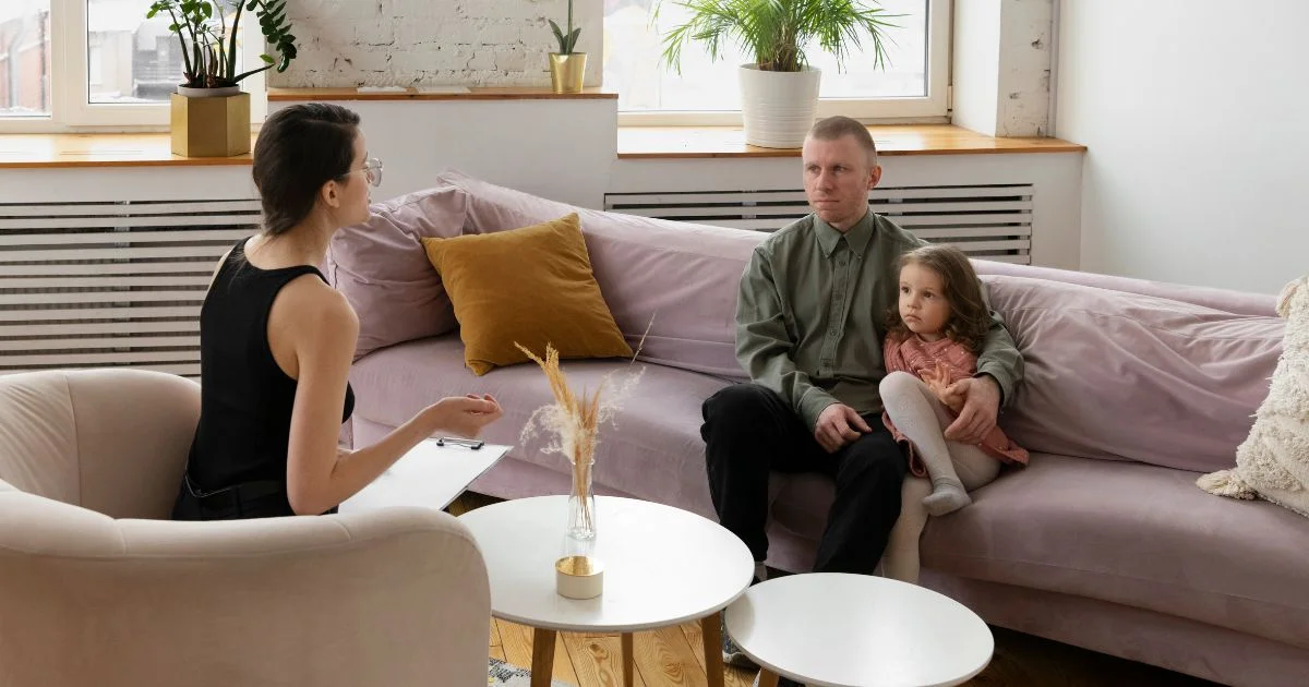 Father and daughter in family mediation session