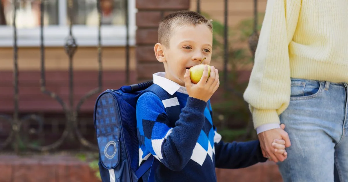 Child with backpack during custody exchange